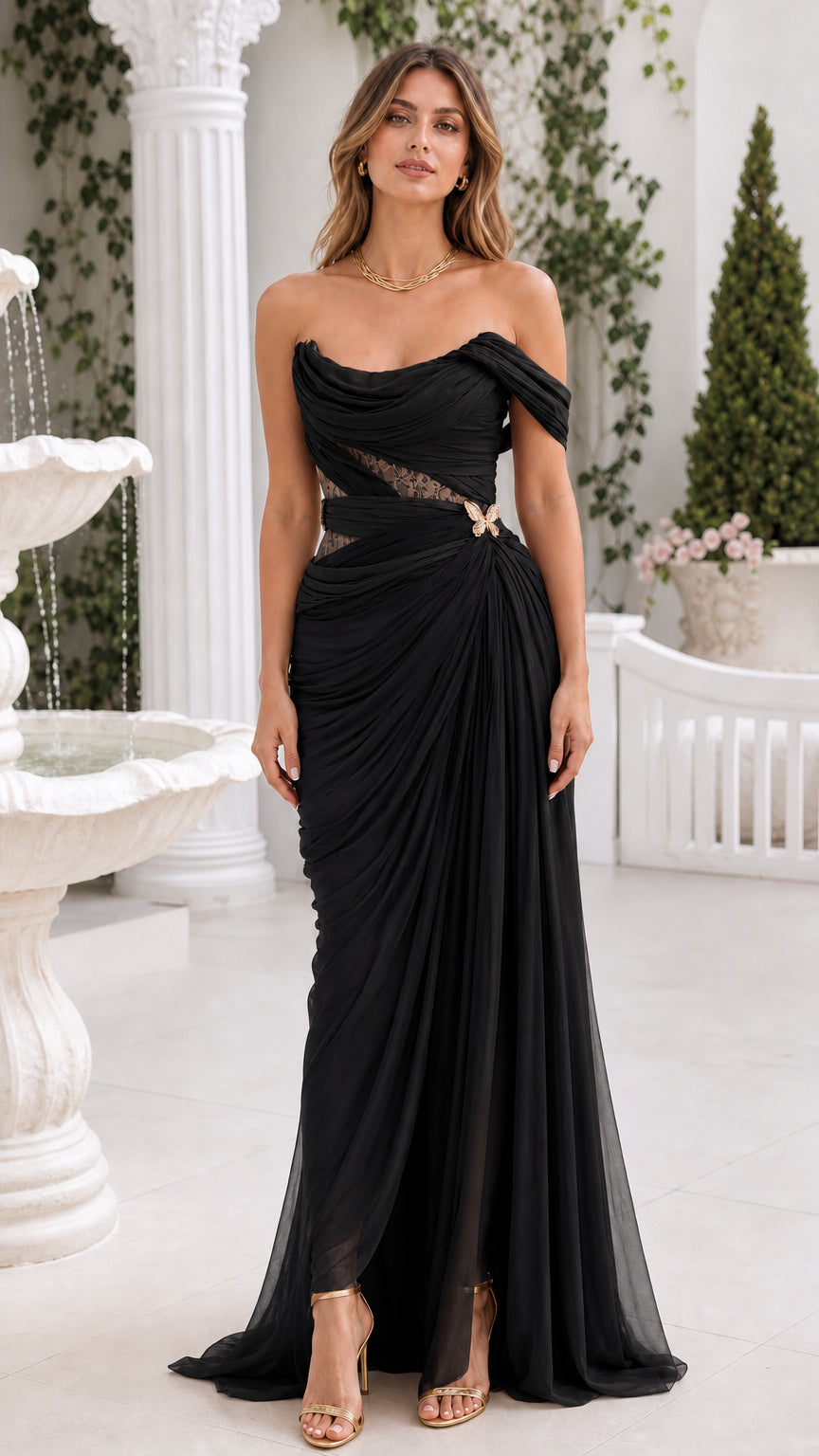 Front view of black off-the-shoulder ruched corset evening gown with slit