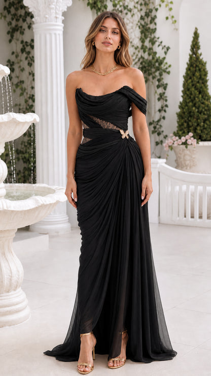 Front view of black off-the-shoulder ruched corset evening gown with slit