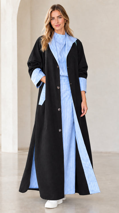 Women's black maxi duster coat with contrast blue striped lapels and cuffs