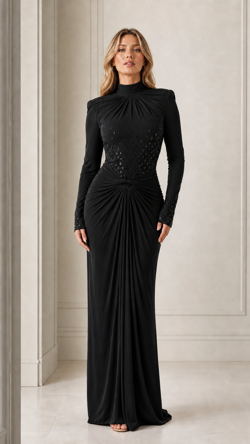 Model wearing the long-sleeve mock neck draped maxi evening gown in black