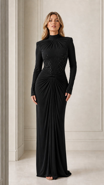 Model wearing the long-sleeve mock neck draped maxi evening gown in black