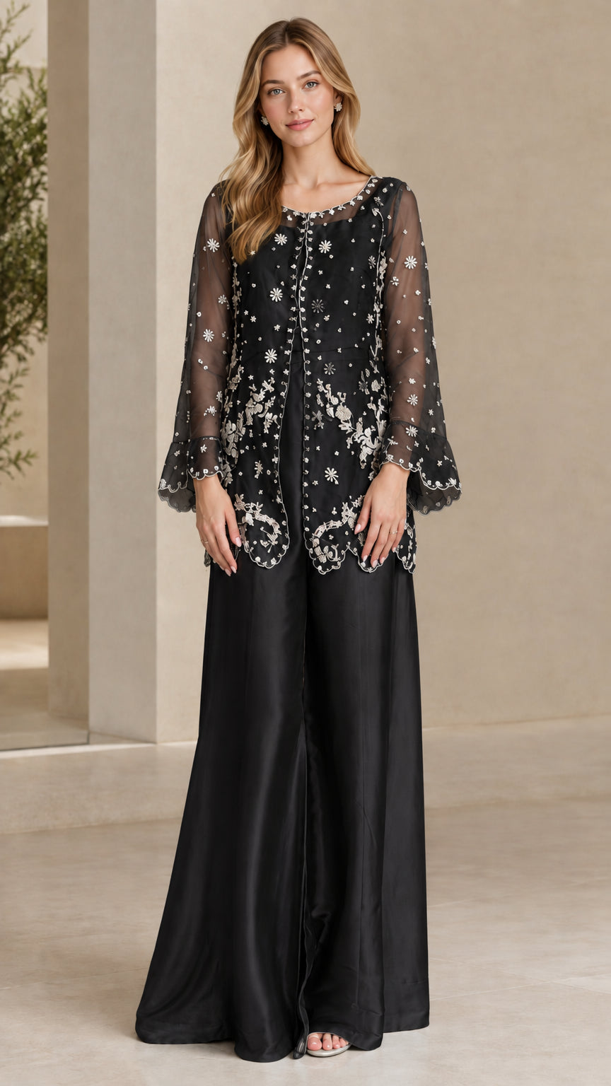 Model wearing Black embroidered sheer sleeve tunic and wide leg pant set