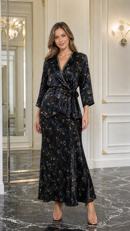 Model wearing black satin floral two-piece set