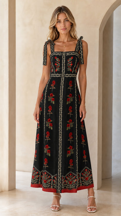Woman wearing black variant of the floral embroidered maxi dress