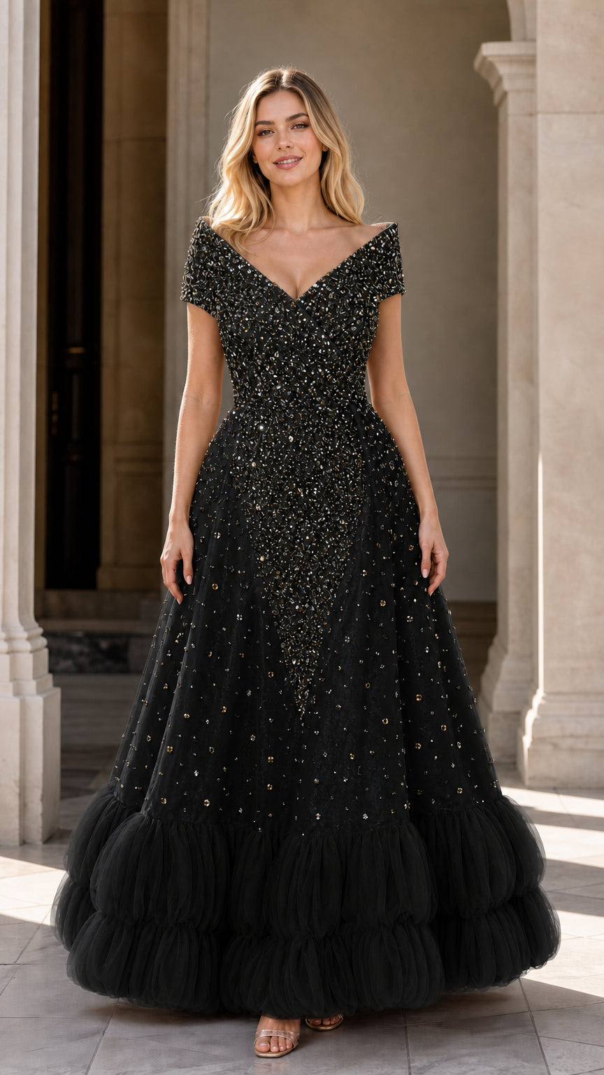 Front view of black beaded sequin evening gown with tiered ruffled skirt