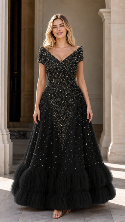 Front view of black beaded sequin evening gown with tiered ruffled skirt