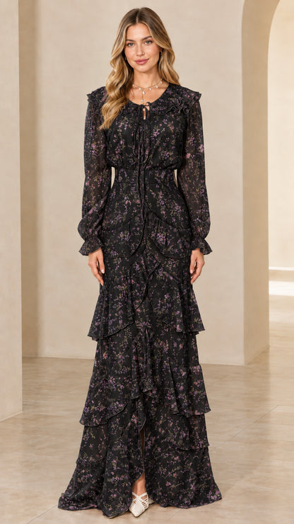 Front view of long sleeve tiered floral maxi dress in black