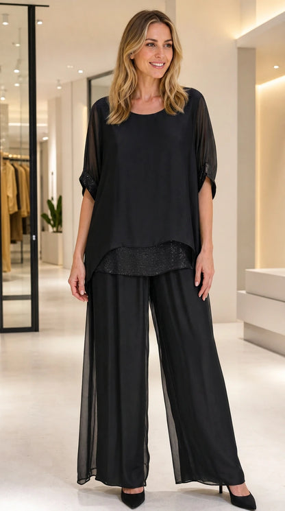 Full front view of women's black 2-piece formal chiffon pant set