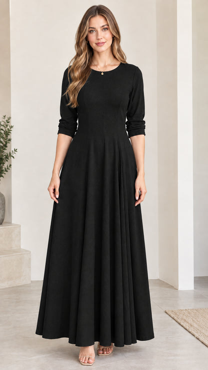 Front view of woman wearing classic black 3/4 sleeve flared maxi dress