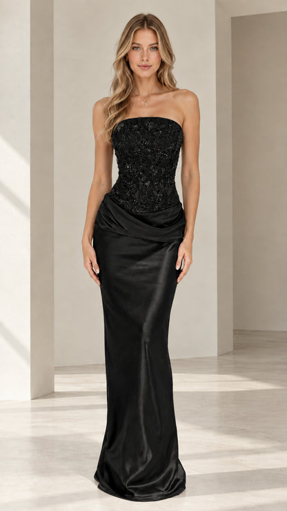 Model wearing black strapless beaded corset satin evening gown