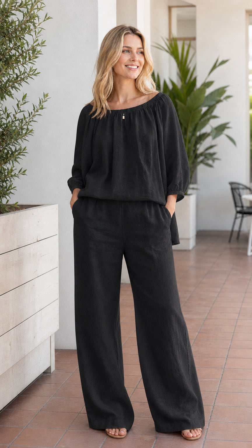 Woman wearing black two-piece pant set