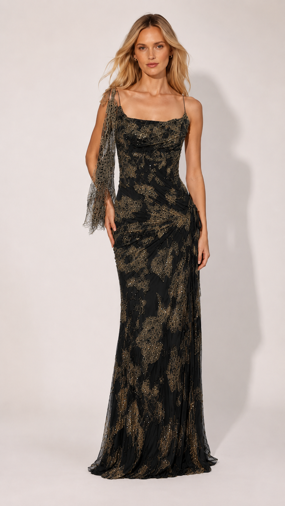 Front view of black glitter mesh evening gown with cowl neck and shoulder scarf
