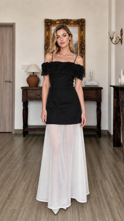 Front view of model wearing black 3D floral off-shoulder maxi dress