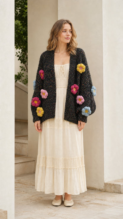Model wearing black chunky knit floral cardigan