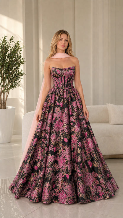Model wearing black and pink floral brocade ball gown