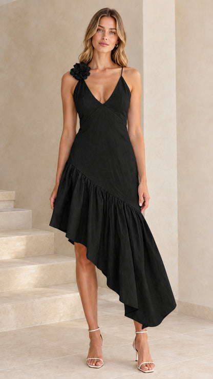 Model wearing black floral applique asymmetrical ruffle midi dress