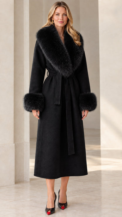Full front view of women's black long wrap coat with matching black plush collar