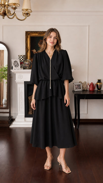 Model wearing black V-neck layered midi dress