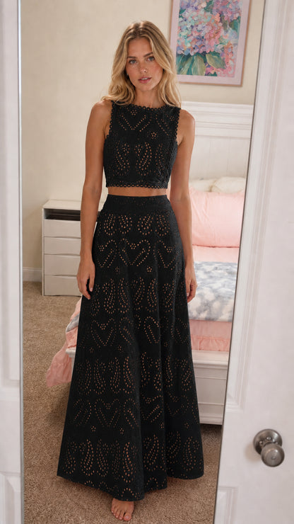 Front view of model wearing black eyelet two-piece set