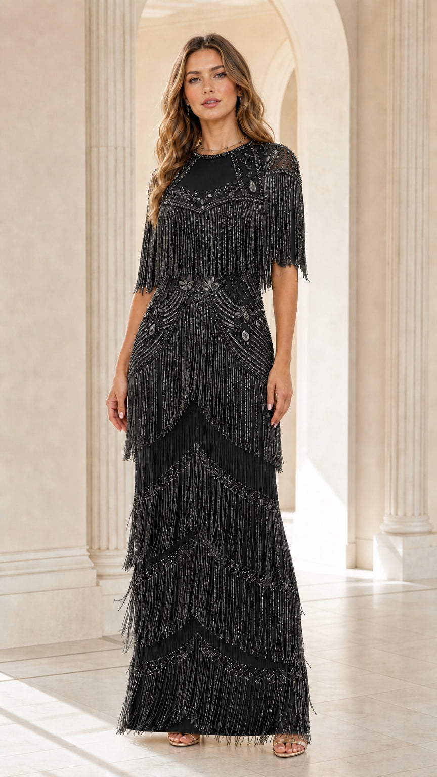 Front view of woman wearing black sequin beaded fringe maxi gown