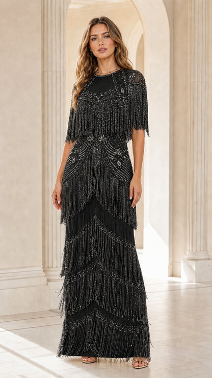 Front view of woman wearing black sequin beaded fringe maxi gown