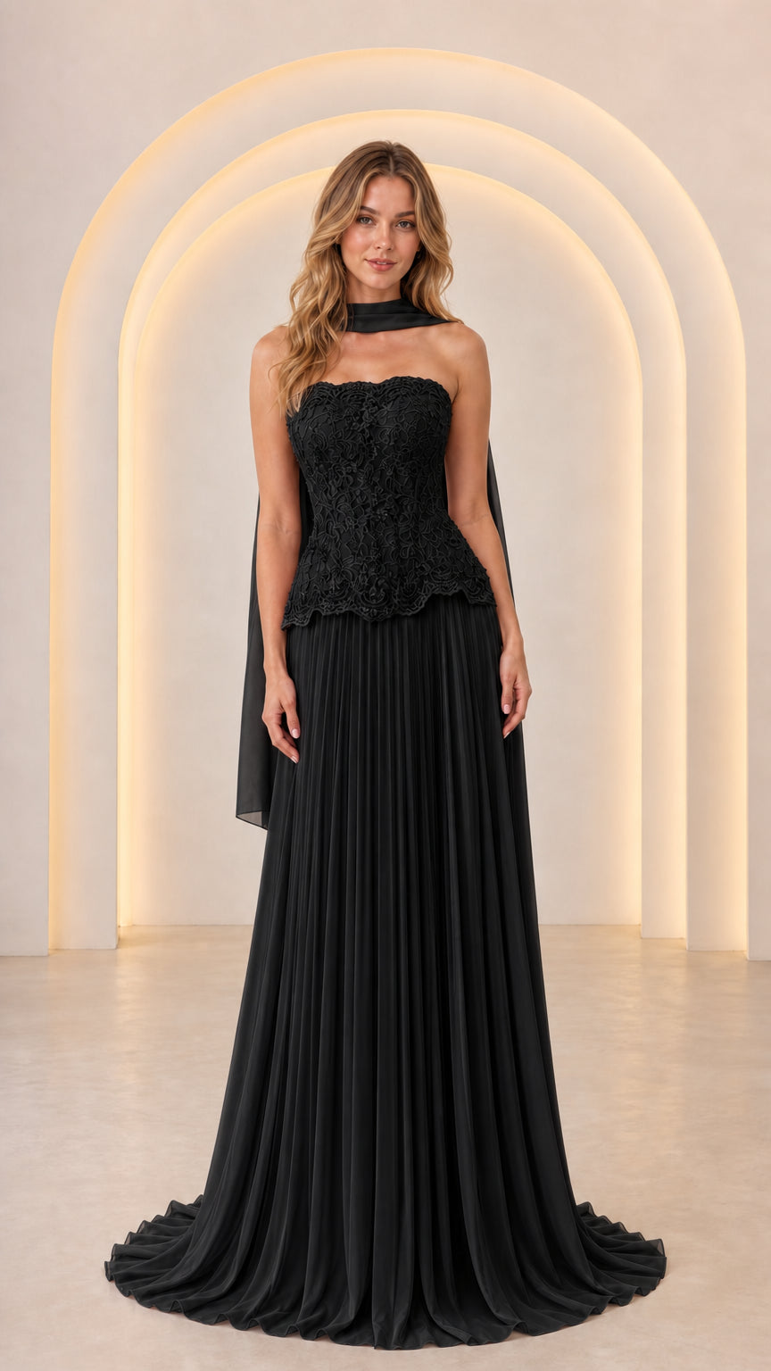 Front view of Black strapless lace peplum formal gown with pleated chiffon skirt and matching scarf