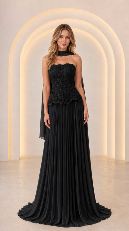 Front view of Black strapless lace peplum formal gown with pleated chiffon skirt and matching scarf