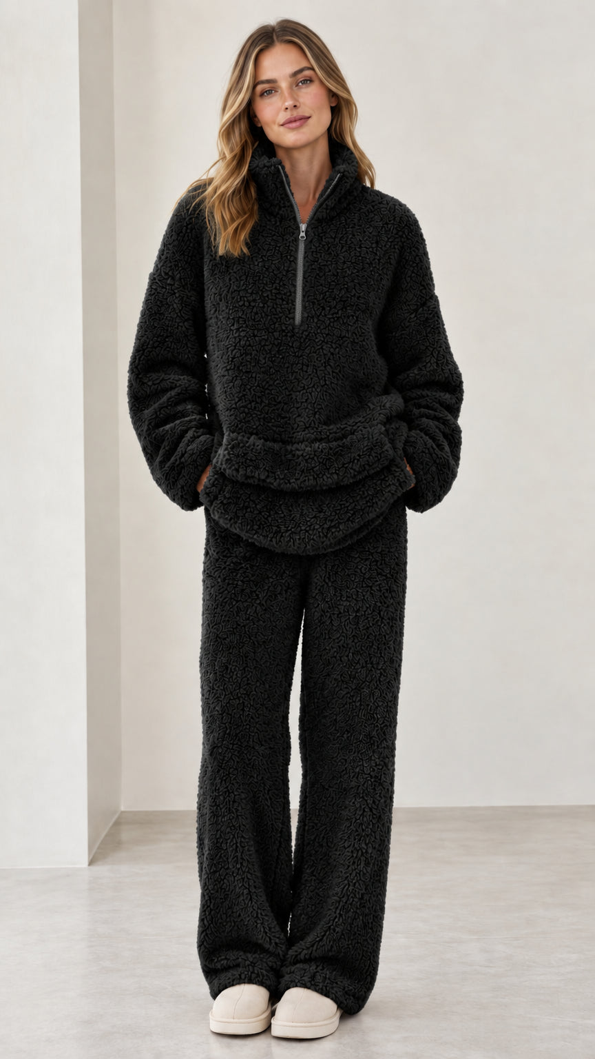 Model wearing black sherpa fleece quarter-zip two-piece lounge set