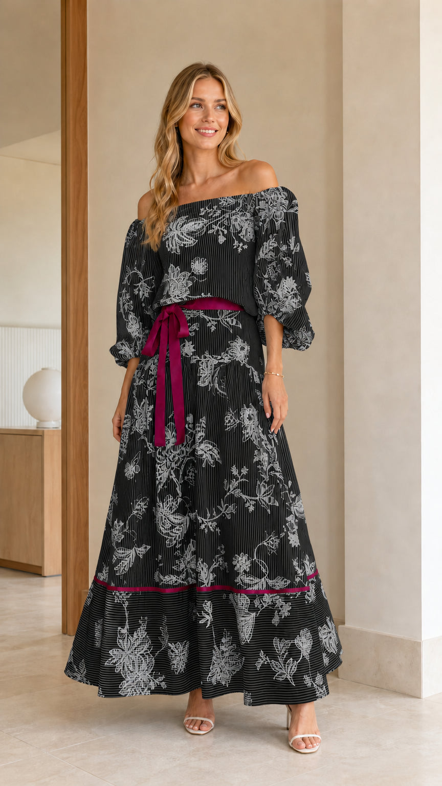 Model wearing Black floral stripe off-the-shoulder tiered maxi dress