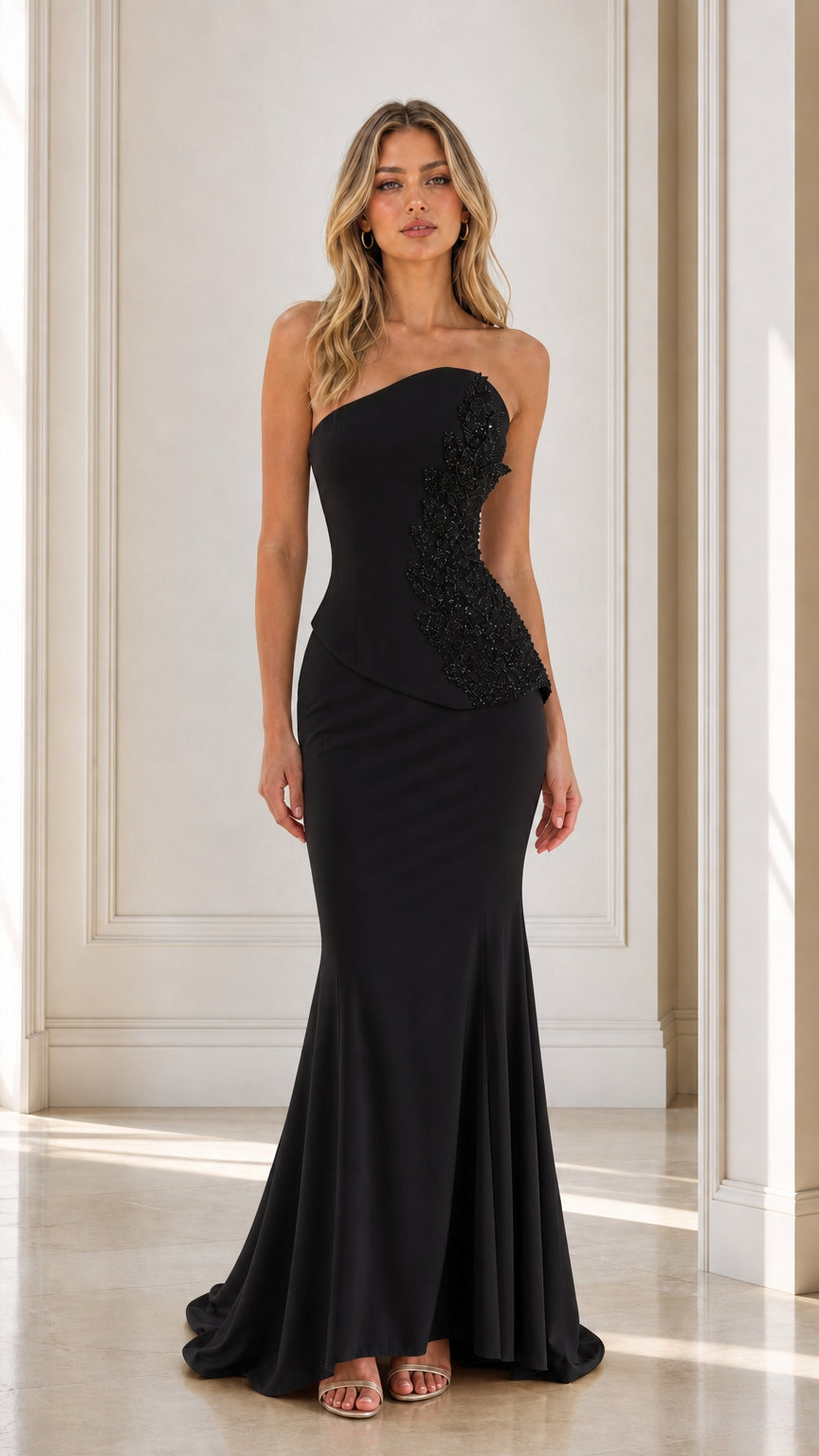Front view of black strapless beaded mermaid evening dress