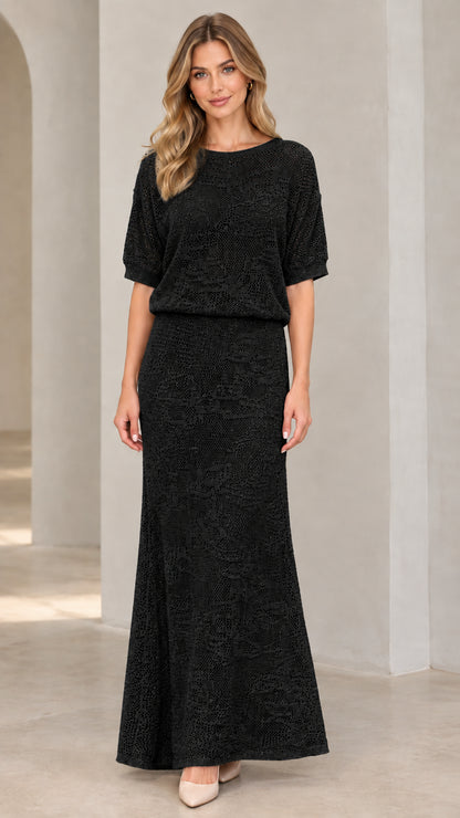 Front view of woman wearing black crochet knit blouson maxi dress