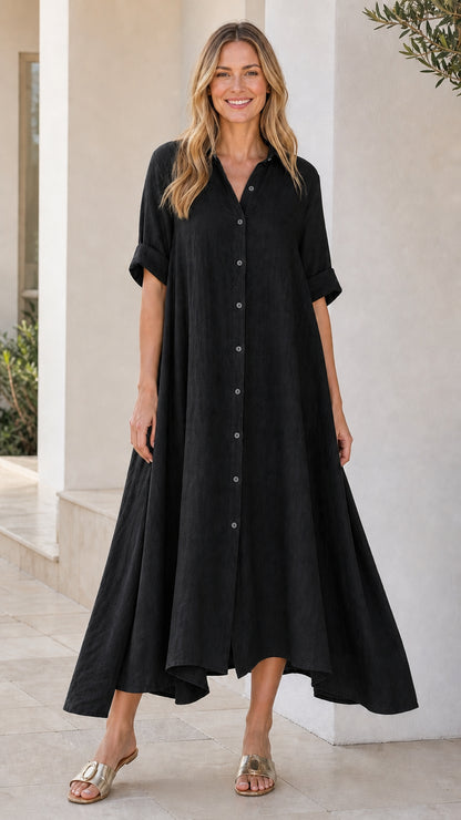 Front view of woman wearing black button-down midi shirt dress