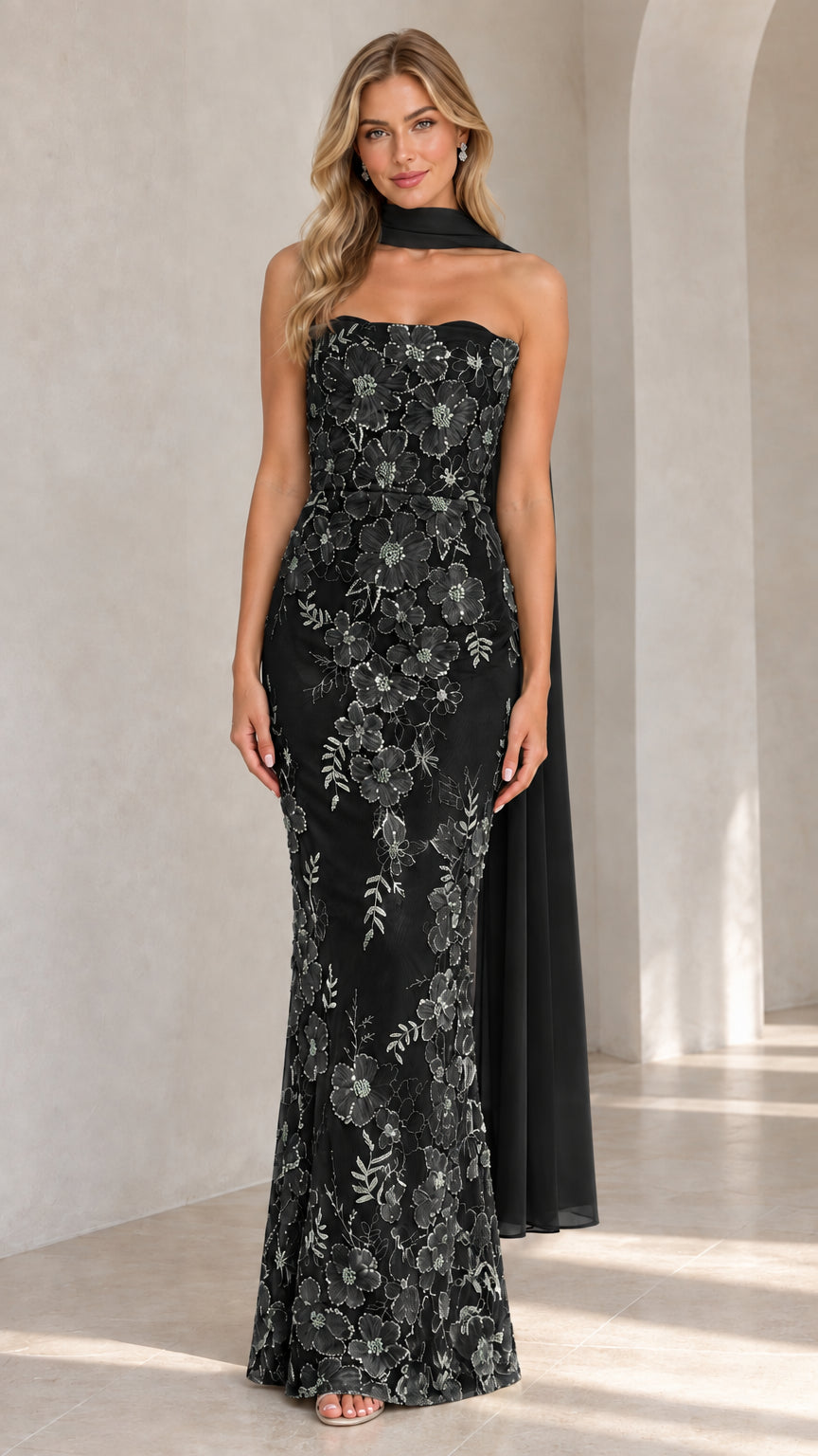 Full-length view of black floral embroidered strapless evening maxi dress