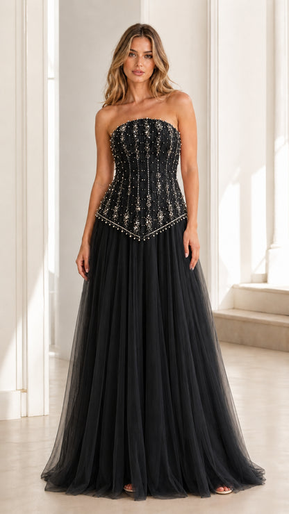 Front view of black embellished strapless tulle evening gown