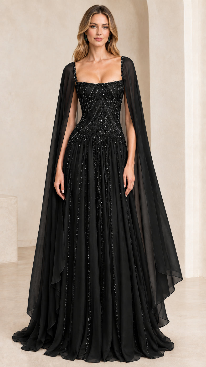 Front view of black beaded cape sleeve formal evening gown