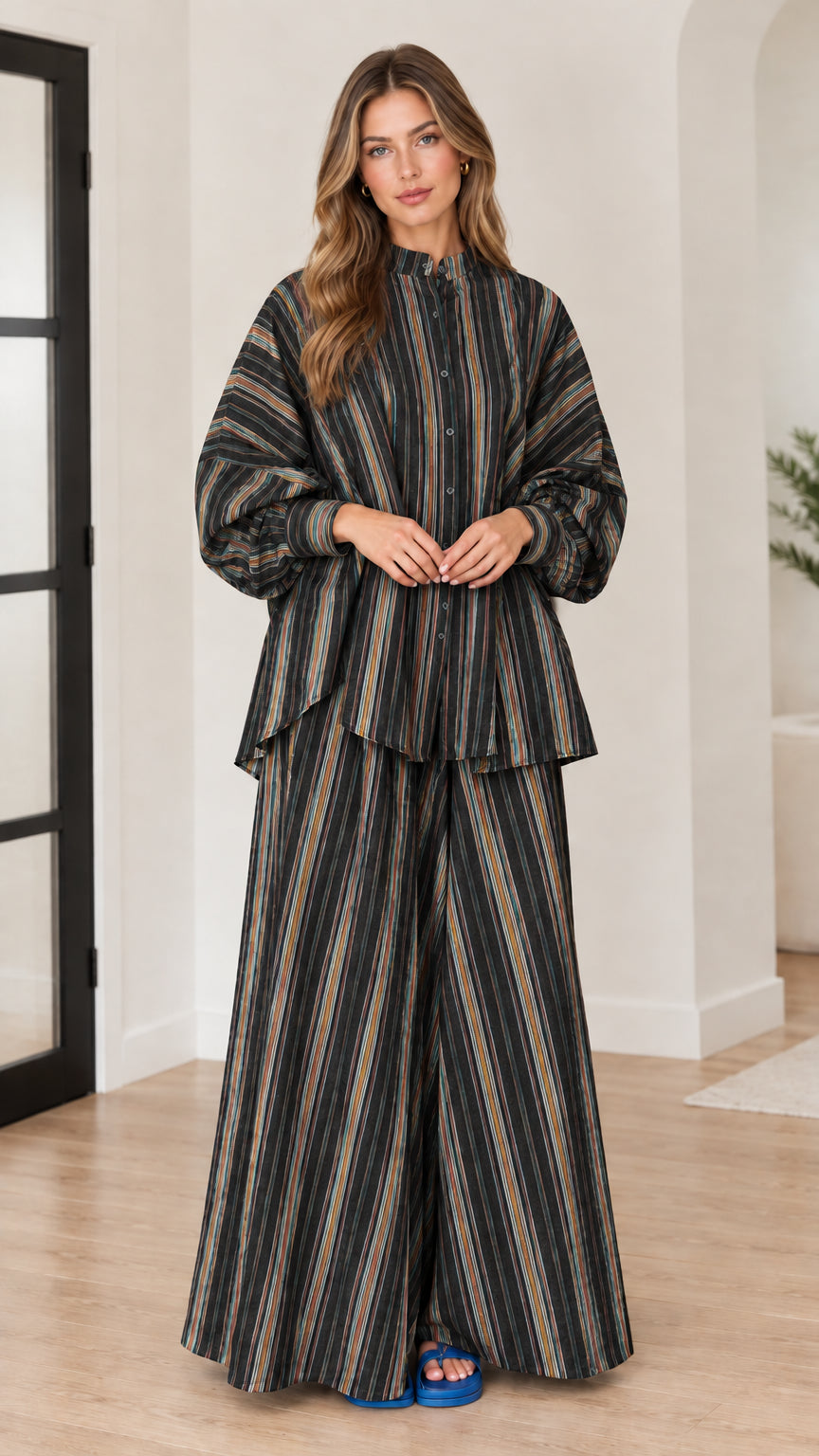 Woman wearing black and charcoal vertical striped two-piece matching set
