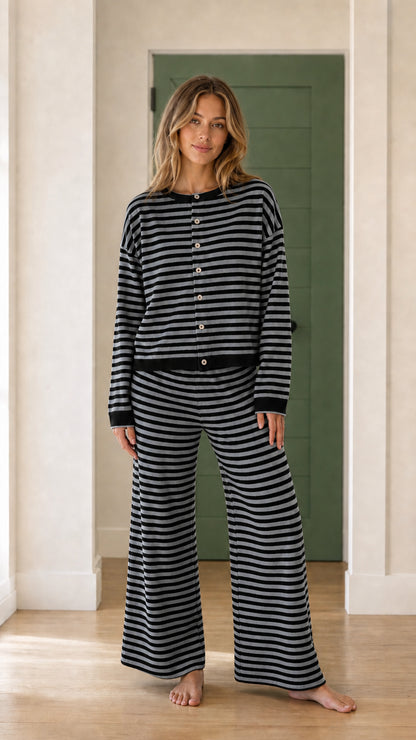 Model wearing black and grey striped knit loungewear set