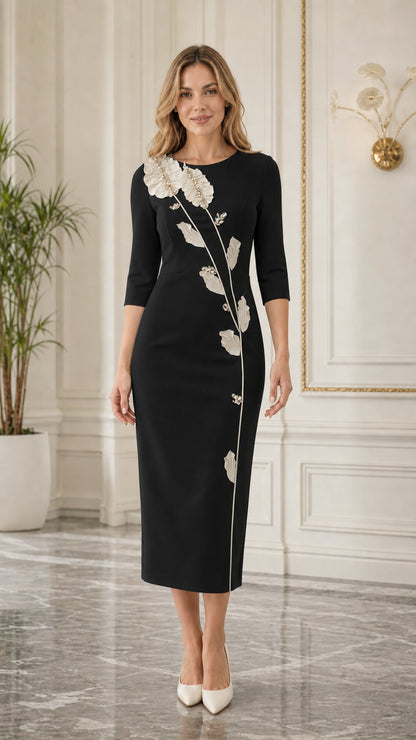 Front view of black midi dress with floral applique