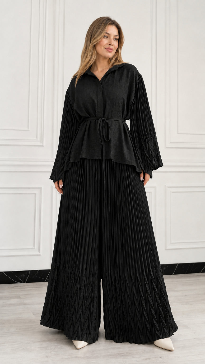 Full front view of woman wearing Black pleated two-piece pant set