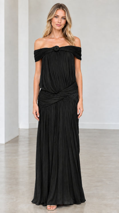 Full-length front view of model wearing Black off-shoulder pleated maxi dress