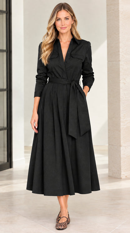 Model wearing classic black long sleeve belted A-line midi shirt dress