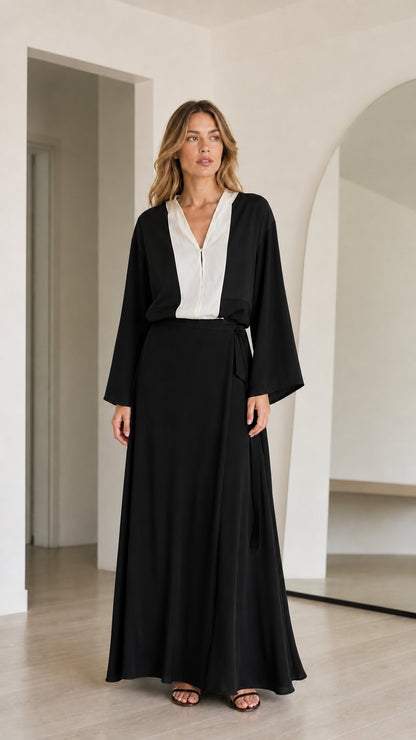 Model wearing Black and white contrast long sleeve maxi dress