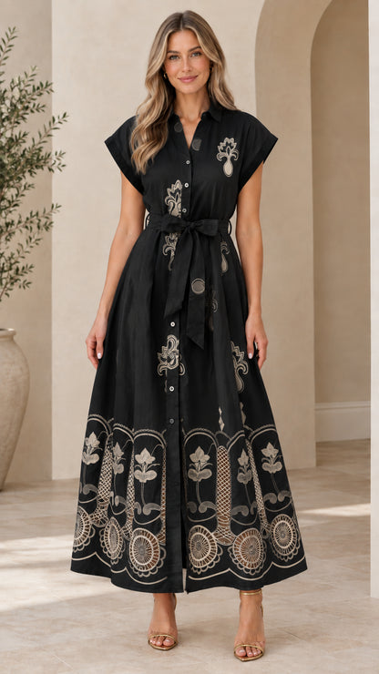 Front view of black embroidered button-down maxi shirt dress with beige embroidery