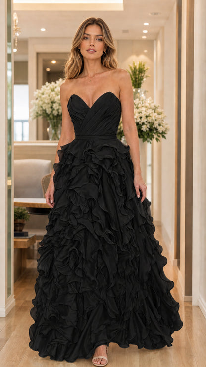Model wearing black strapless ruffled evening dress
