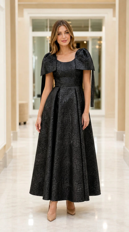 Full-length view of model wearing Black metallic capelet jacquard maxi evening dress