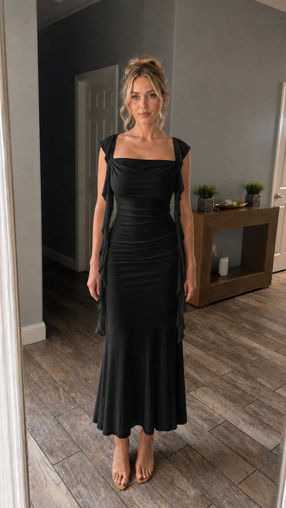 Front view of model wearing the black color variant of the maxi dress