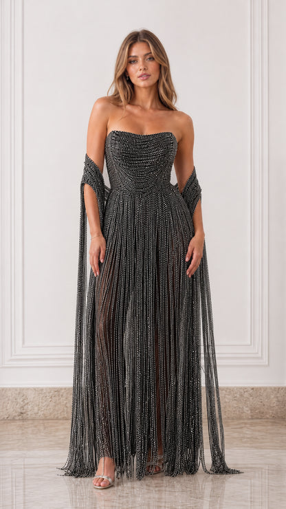 Full-length front view of black strapless beaded fringe evening gown