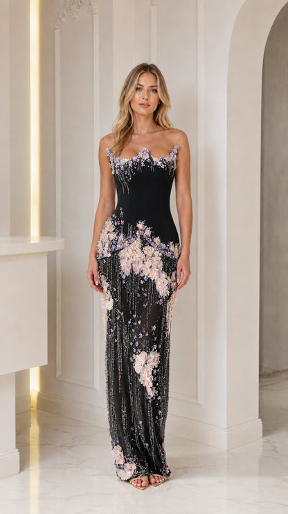 Front view of black embellished strapless gown