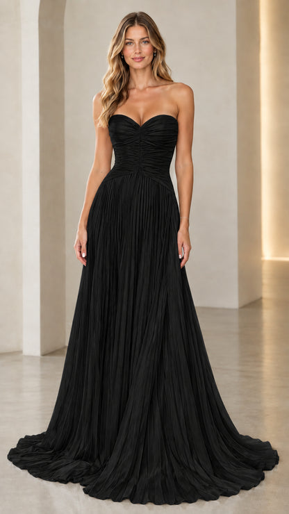 Model wearing black strapless sweetheart pleated formal gown