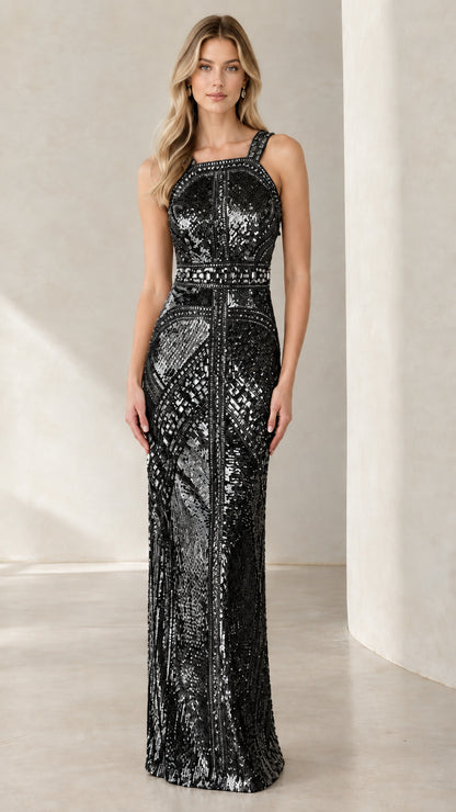Front full view of woman wearing black geometric sequin column formal gown